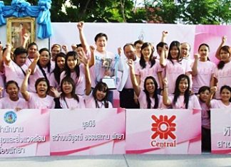 Some of the walkers gather on stage to begin the World Pink Charity Walk to raise funds to support patients with breast cancer at Her Majesty Queen Sirikit’s Center.